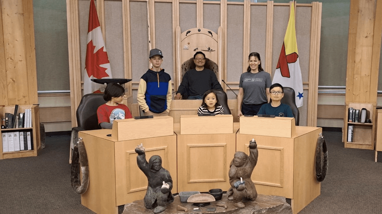 Kim family during educational tour of the Legislature building of Nunavut in Iqaluit.