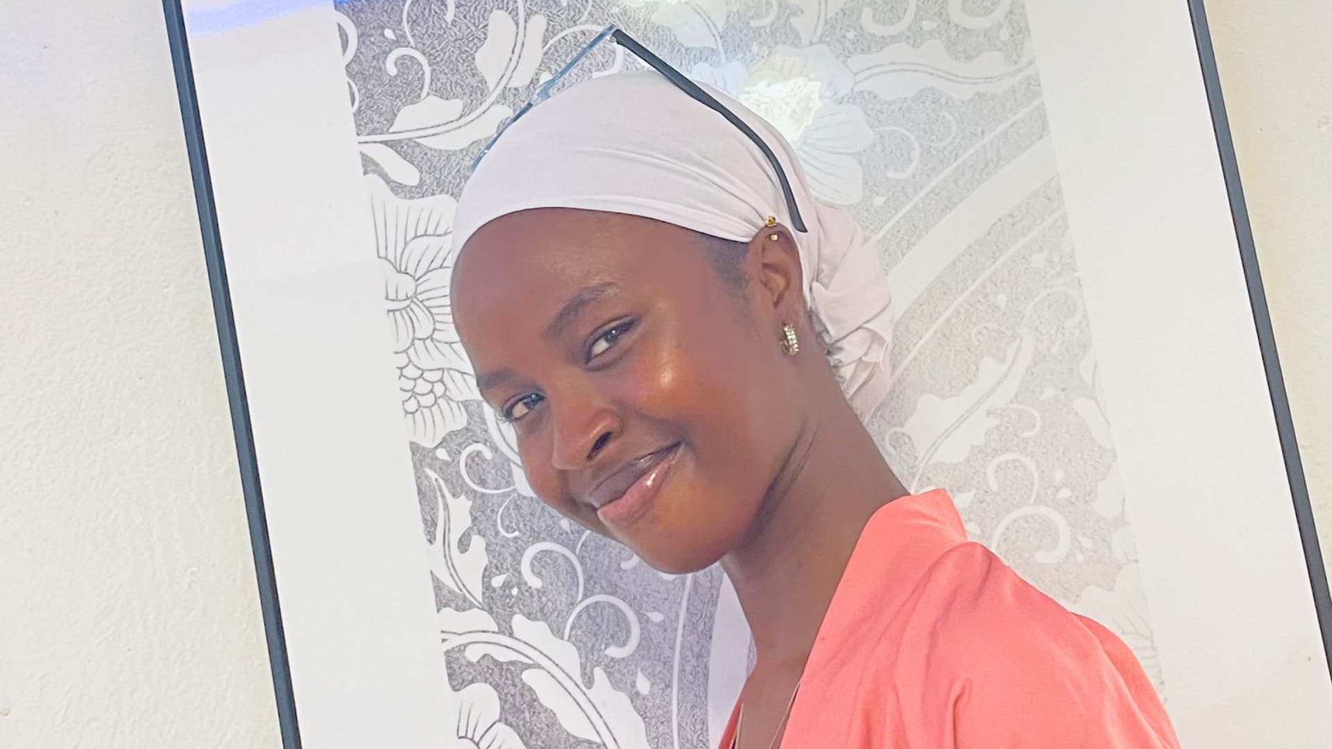 A young woman smiling softly