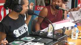 Two young women speaking during a radio broadcast