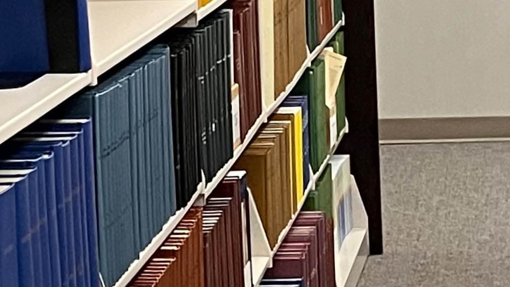Periodicals on shelves in a library.